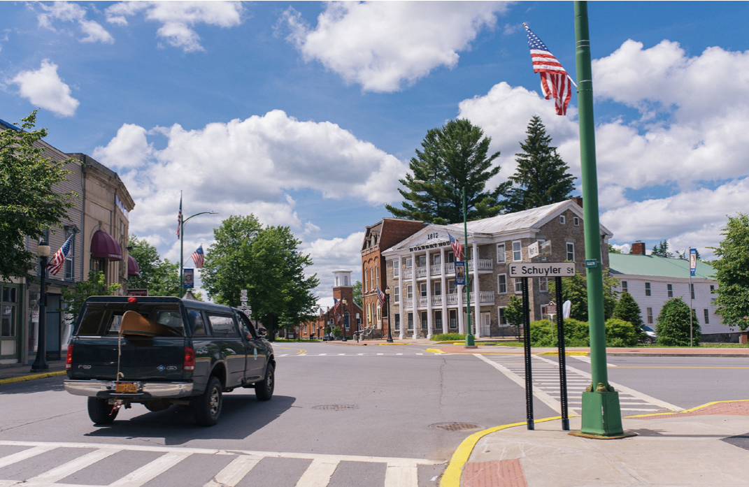 Street scene featuring crossroads in a small town.