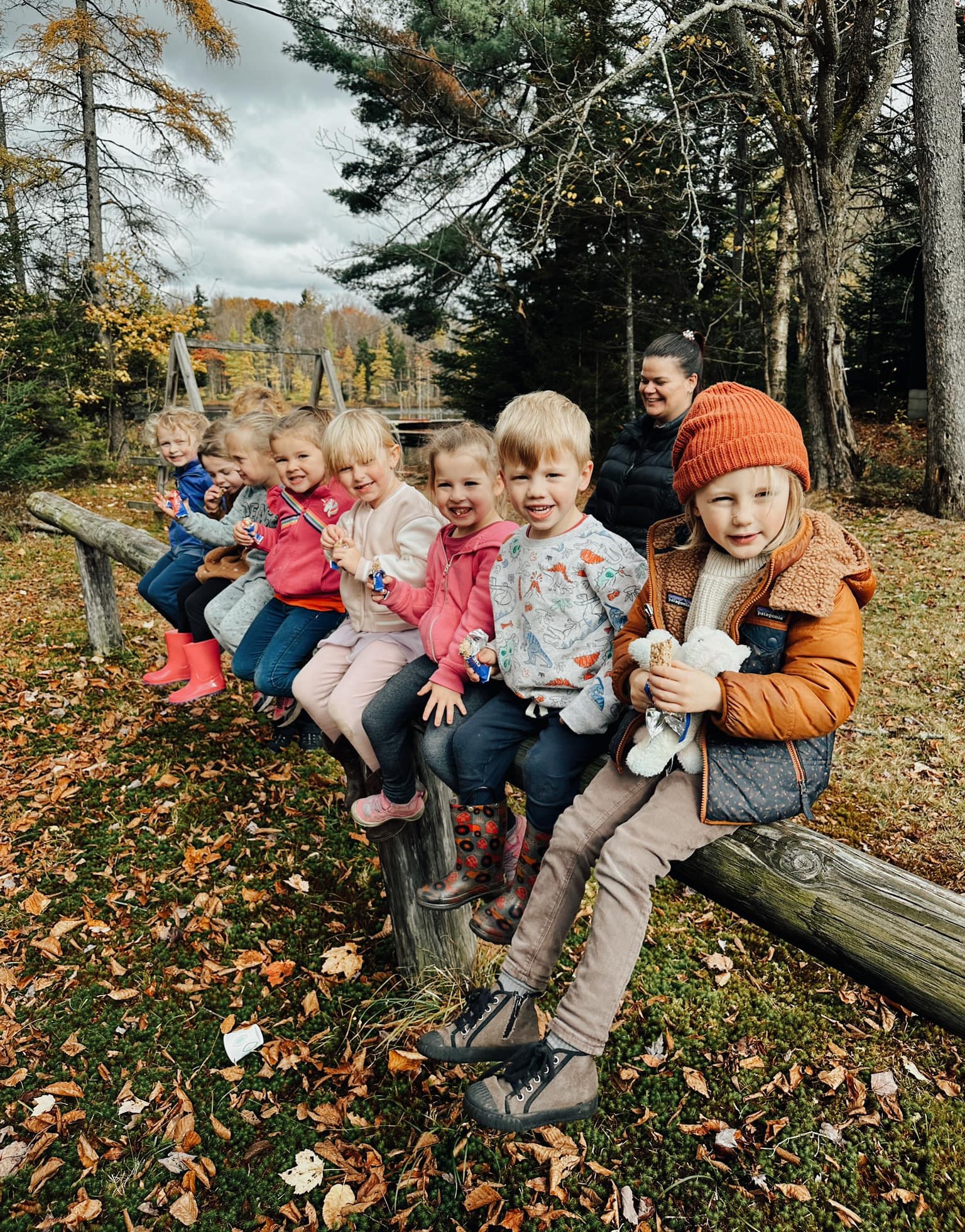 Children sitting on a fence