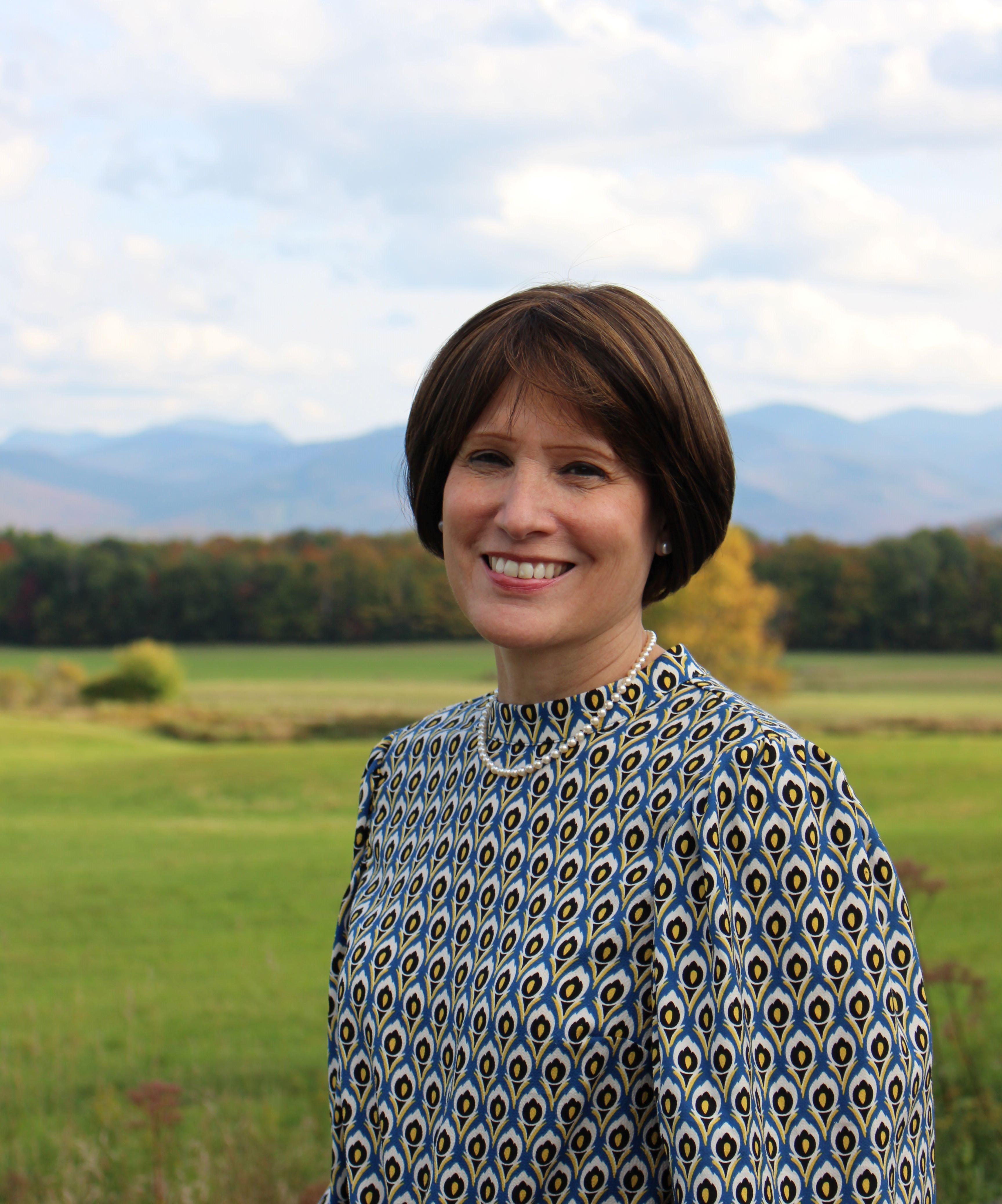 woman in front of mountain view