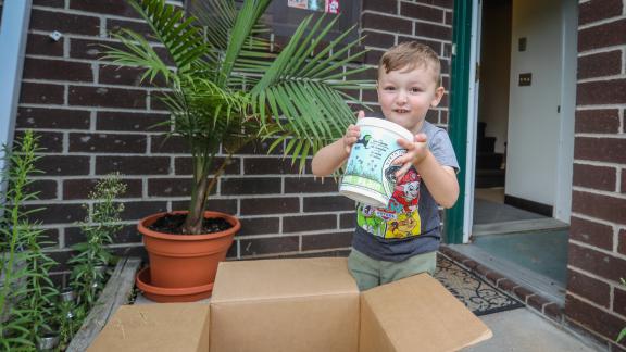 Little boy with North Country Creamery yogurt 