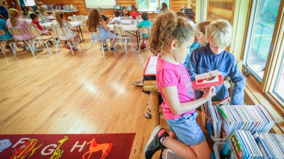 Kids reading at YMCA Adirondack Center