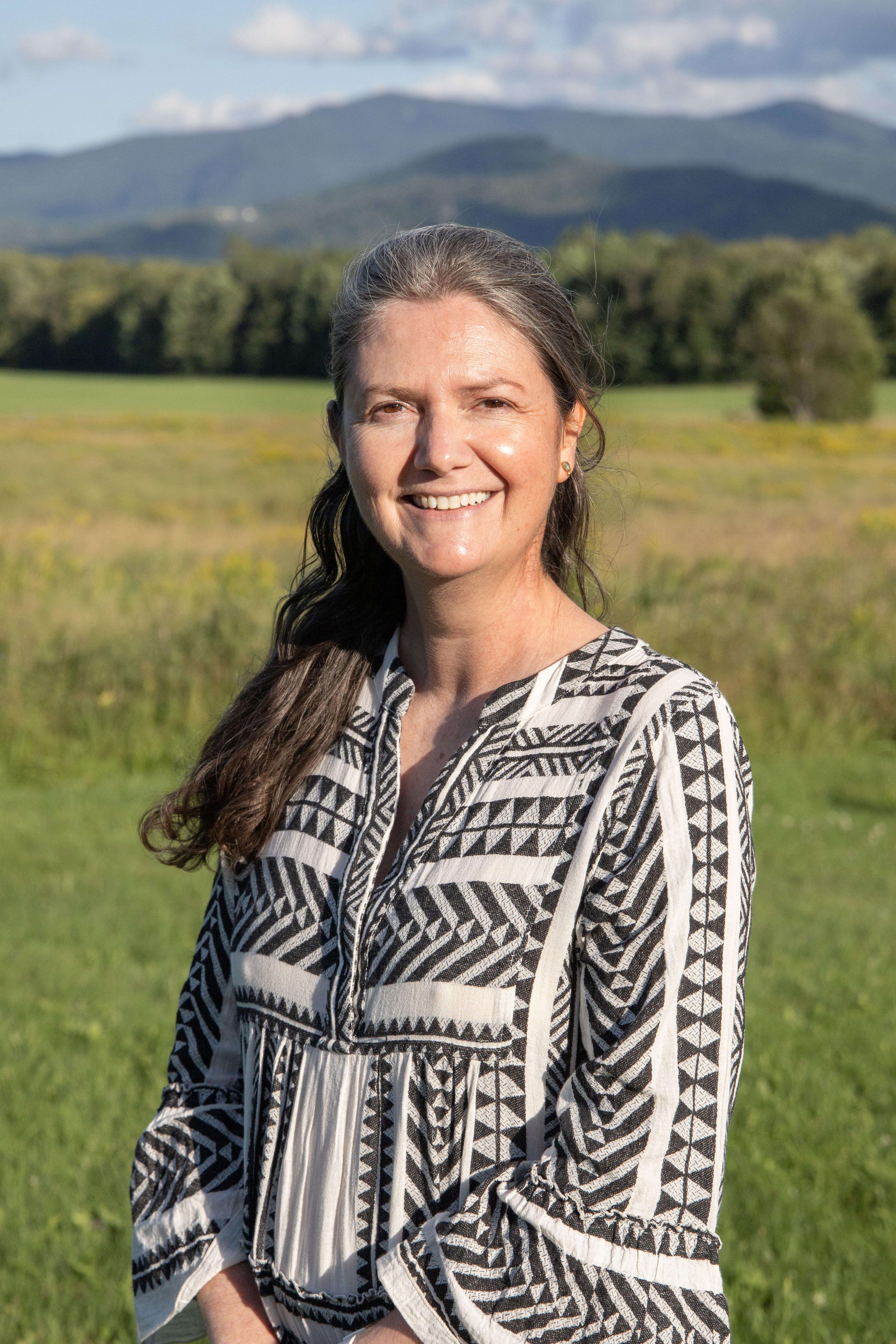 woman standing in front of mountain view