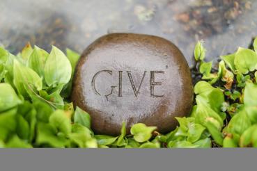 Rock engraved with the word give